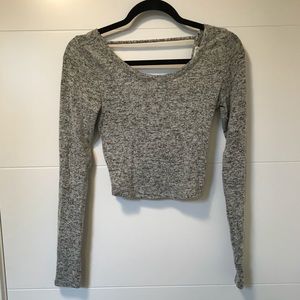 A cropped long sleeve top.